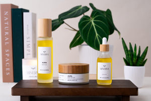 The Minerva body care set on a wooden tray with plants and books