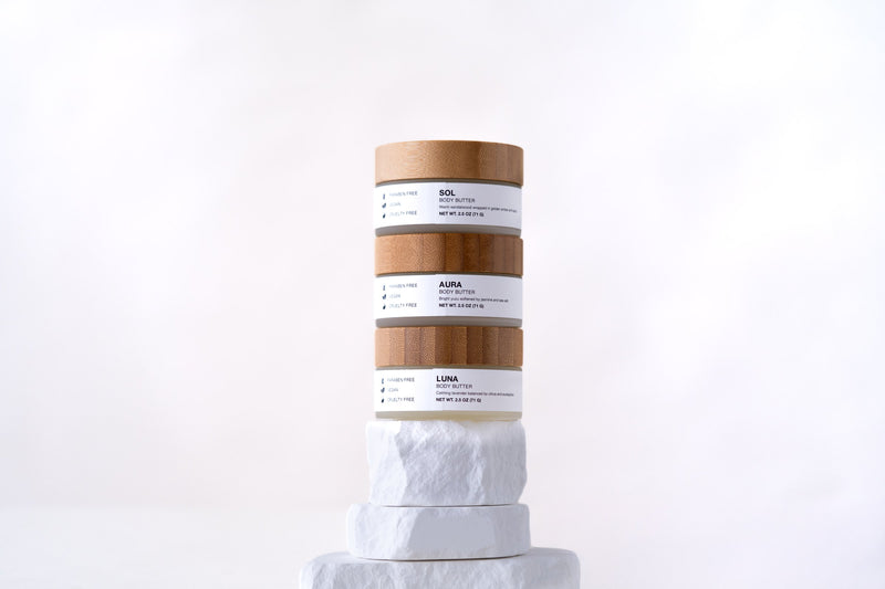 Stack of Minerva Sol, Aura and Luna body butter jars
